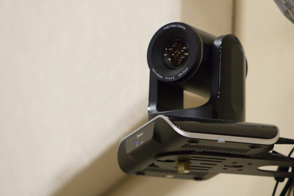 A camera attached to the side of a wall